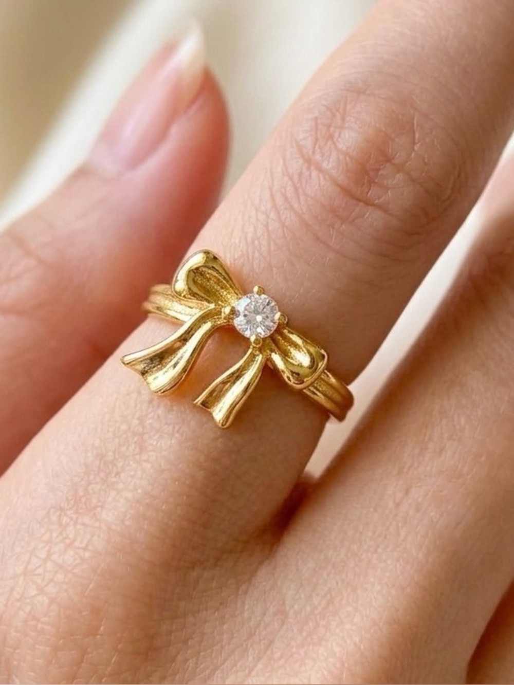 Gold Bow Ring with Clear Stone Accent